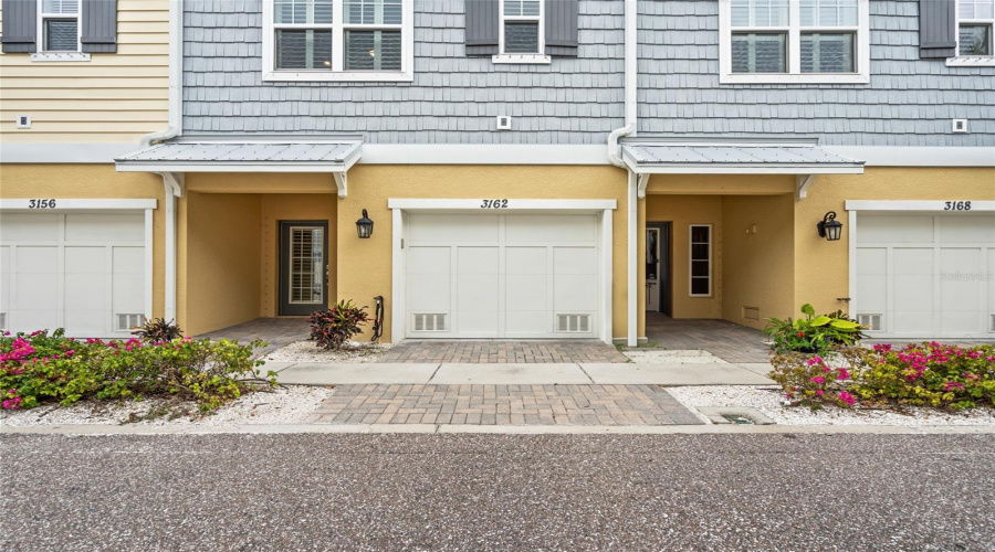 Private Entry With Access To Tandem Oversized Two-Car Garage With Additional Space For A Golf Cart.