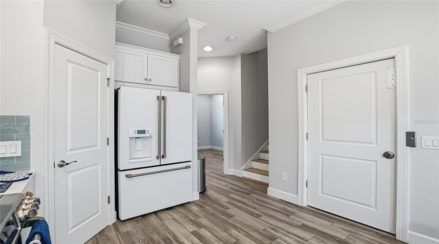 The Door To The Right Leads To The Elevator, And The Stairs To The Bedrooms Are Just Ahead