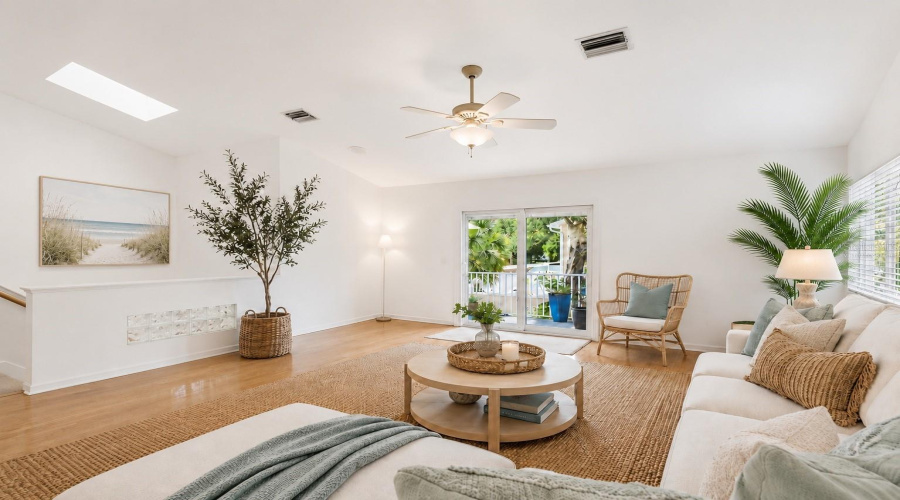 Virtually Staged. Living Room With Skylight Over Stairs.