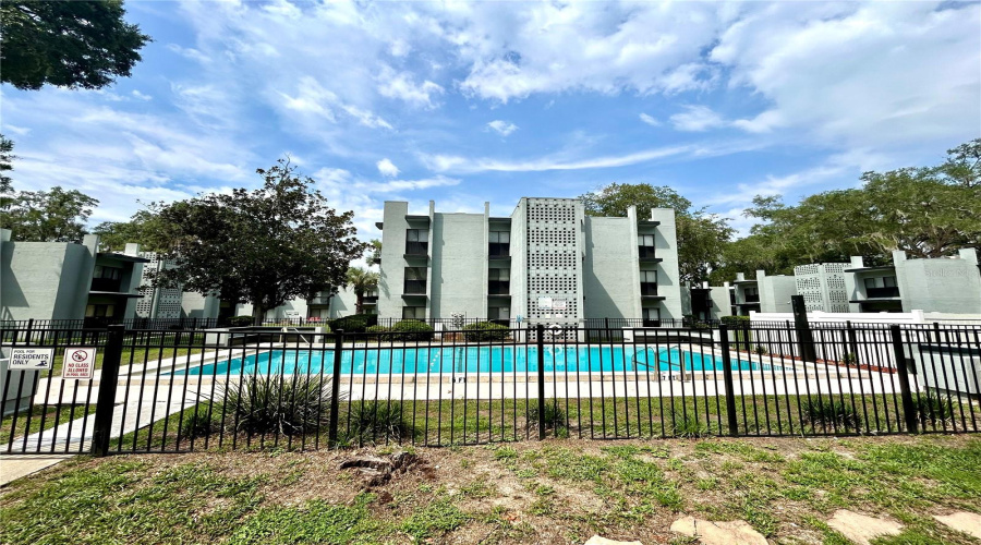 Exterior Of Concordia Condos And Community Pool