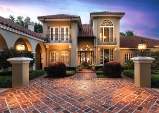 When the sunsets the home is illuminated by warm and inviting lighting coming from the residence and landscaping. It is all designed to welcome you home day or night.