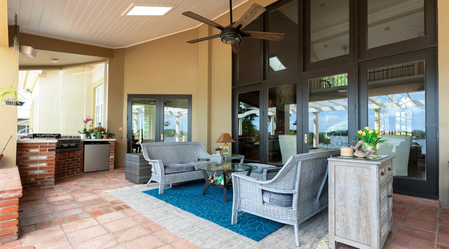 Outdoor Grill And Cooking Area With Covered Porch And Skylights.