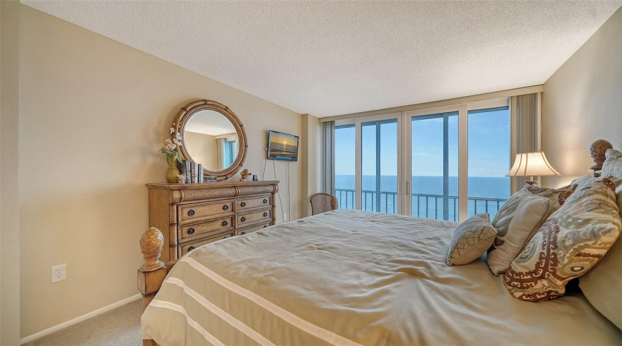The Primary Bedroom Has A View That Makes You Want To Stay In Bed And Enjoy It...