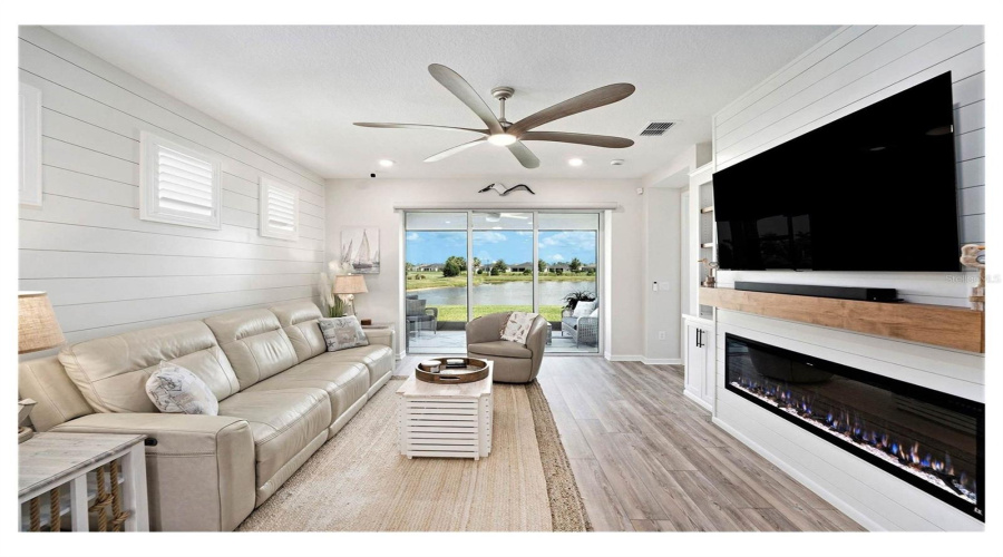 Shiplap, Media Center And A Calming Water View Adds The Wow To This Home