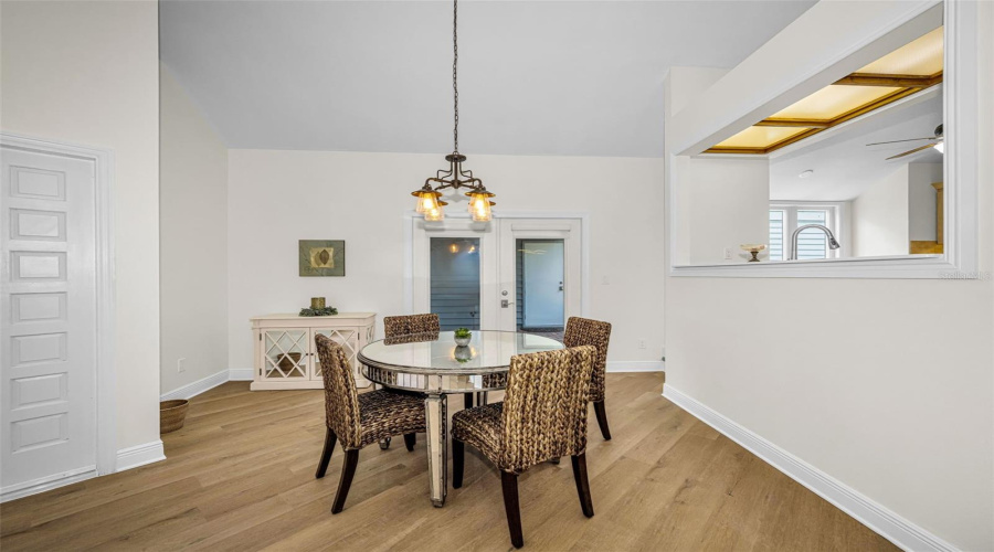 Clean And Fresh Dining Area Opens To The Screened Breezeway, Which Leads To The Backyard And Garage. Perfect For Entertaining!