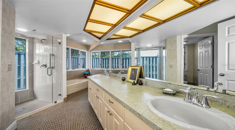 Master Bath With Tub And Shower And Double Vanity And Custom Cabinets