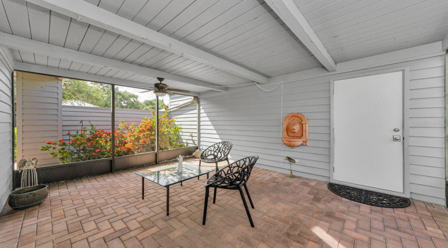 The Breezeway Next To Garage, With Brick Pavers And The Door Into The Garage.  What A Great Private Space!