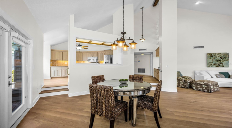 Upon Entering You Have A Large Living Room, Dining Room And Open Kitchen Area With Volume Ceilings And So Much Natural Light. The Door To The Left Is The Breezeway Which Leads To The Garage!
