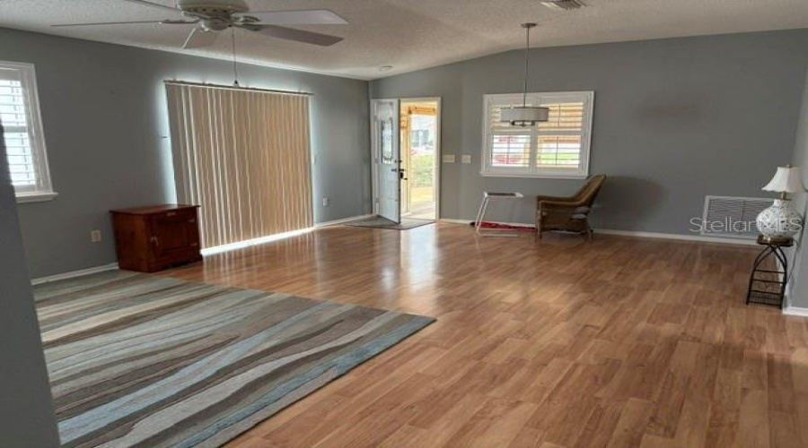 A Very Spacious And Open Great Room!    It Does Hold A Lot Of Furniture And A Seperate Dining, Tv Watching - Game Playing And Moore.  High Ceilings - Lamanite Floors.