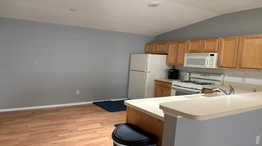 The Kitchen Has Updated Appliances - Gas Cooking!  Counter Dining For Quick Lunches And Then Back To The Course. Laumdry Is On The Other Side Of The Kitchen!  In The Ac!