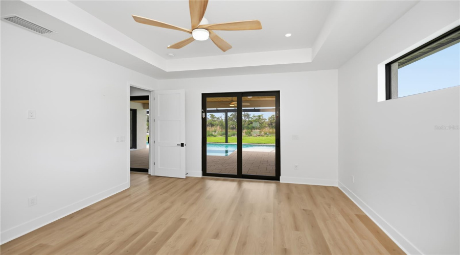 Primary Bedroom Suite With Beautiful Pool And Preserve Views.