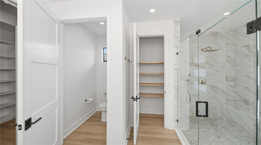 Walk-In Shower And Custom Storage.