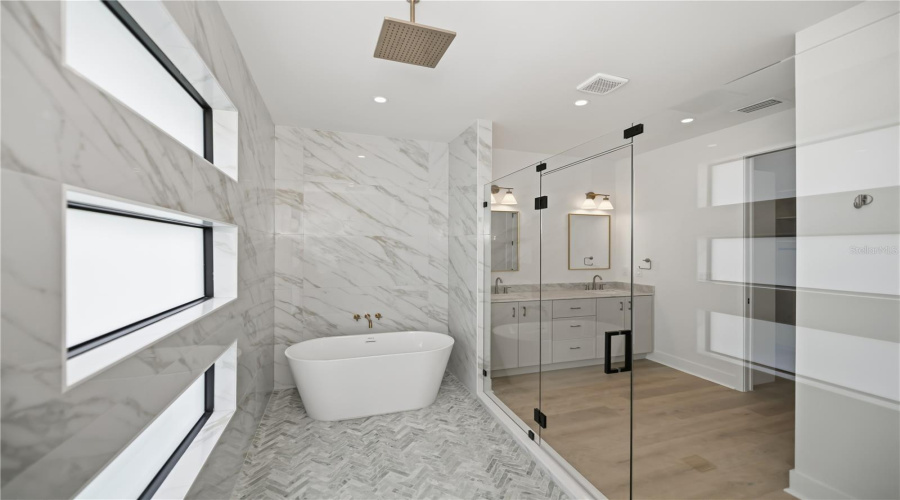 Primary Bathroom Walk-In Shower With Freestanding Bath Tub.