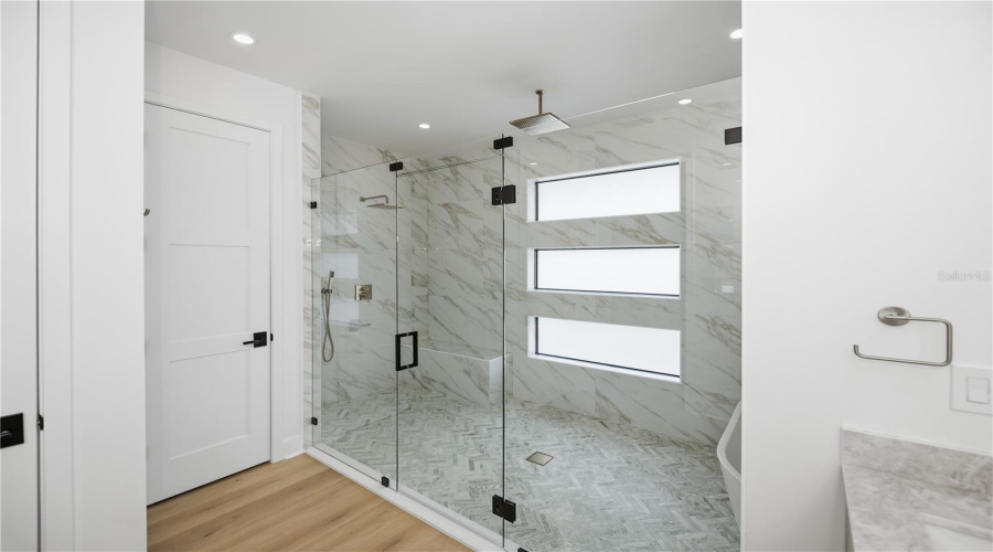 Luxury Walk-In Shower With Glass Enclosed Rain Shower.