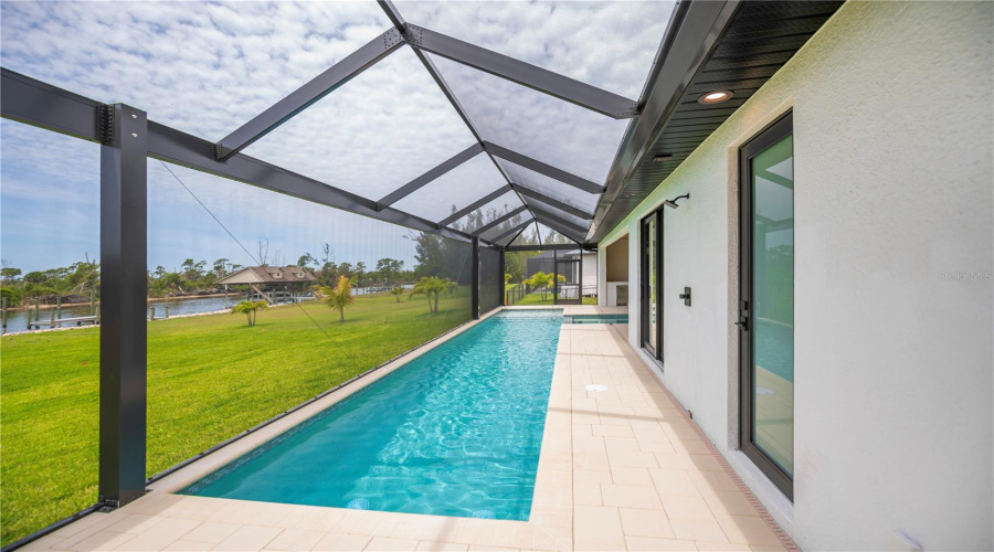 Expansive Screened Pool Overlooking Water Views.