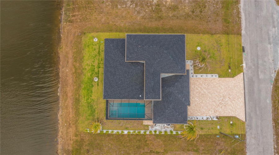 Pool, Paver Driveway And Waterfront Views,
