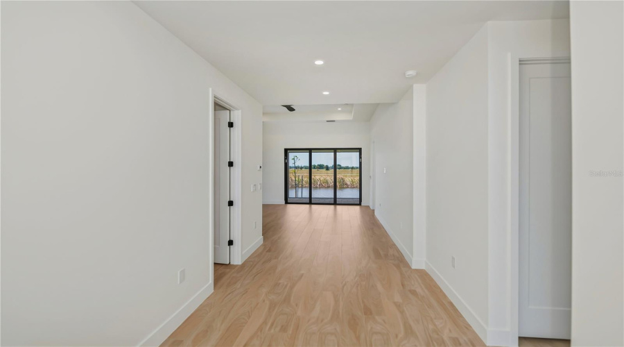 Light Filled Hallway With Water Views.