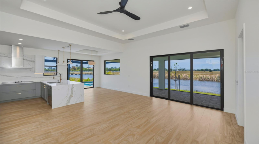 Open Concept Living With Direct Access To Pool And Patio.