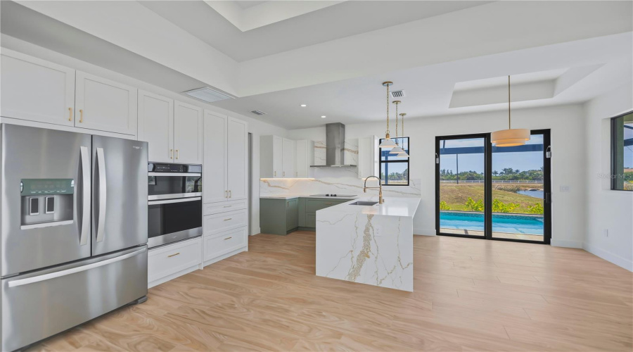 Chef Style Kitchen With Quartz Waterfall Countertops