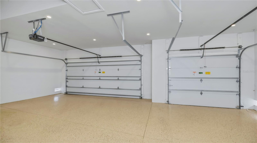 3 Car Garage With Epoxy Floor And 2 Bay Door