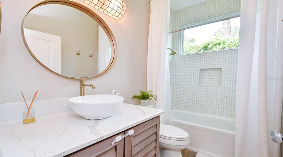 Beautifully Renovated Bath With Custom Tilework.