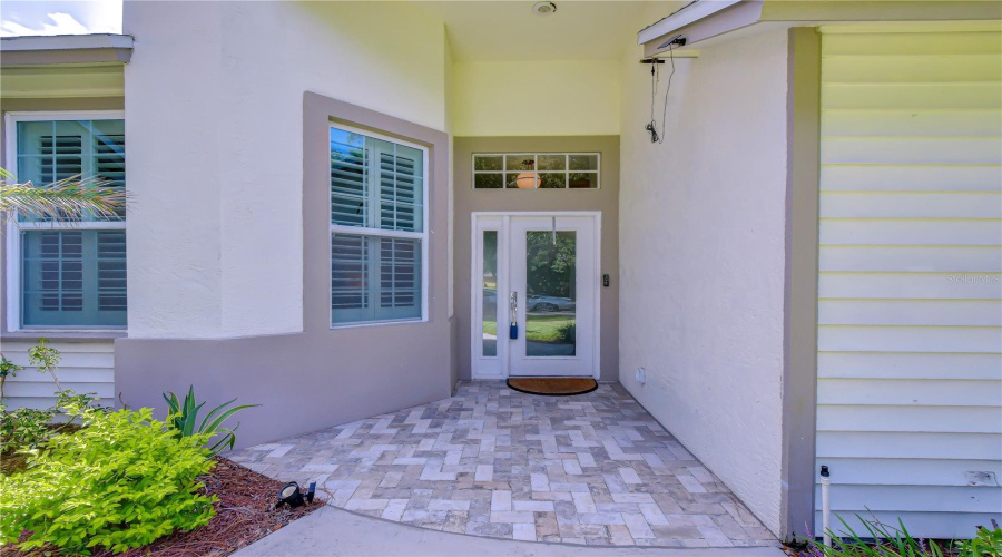 Inviting Entrance With Refined Architectural Details.