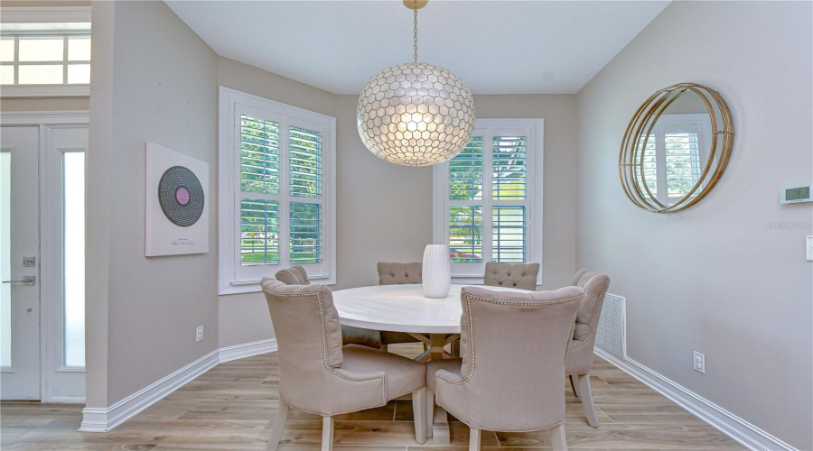 Elegant Dining Space Seamlessly Connected To The Kitchen.