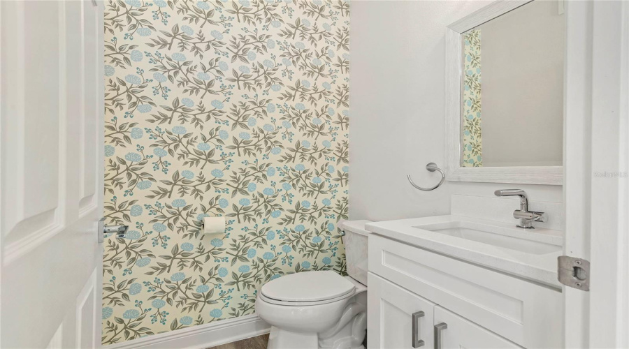 Designer Wallpaper And Updated Vanity In Powder Bath Off Kitchen