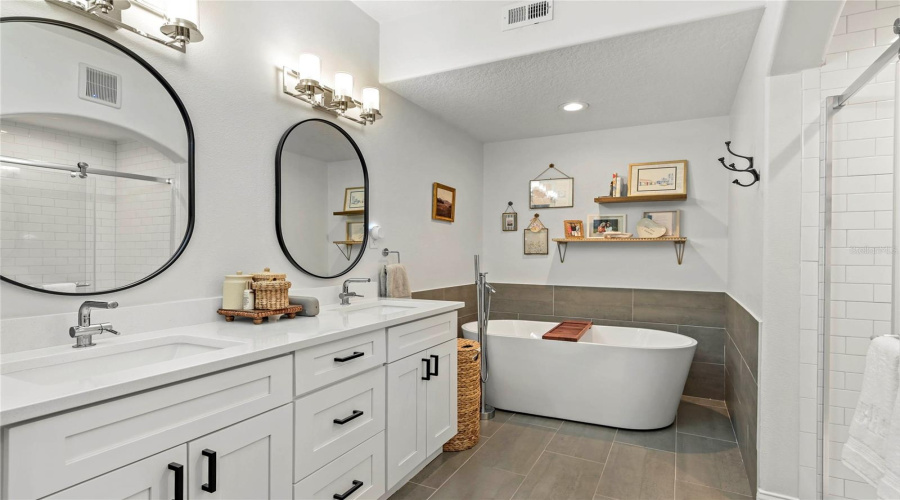 Dual Sinks, Quartz Countertops And A Soaking Tub