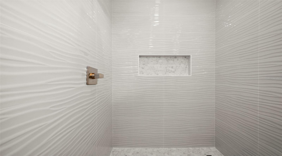 Guest Bathroom Tile Shower With Built-In Niche.