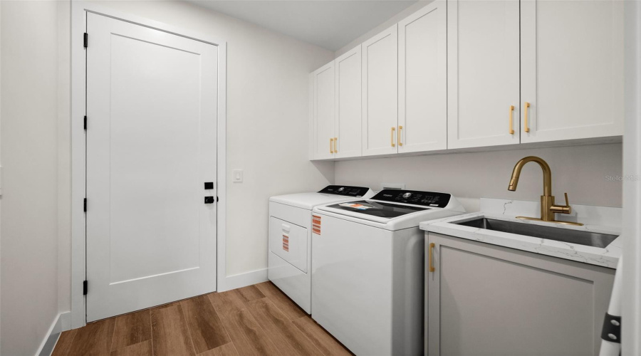 Spacious Laundry Room With Utility Sink.
