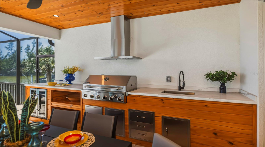 Professional Outdoor Kitchen With Built-In Grill.