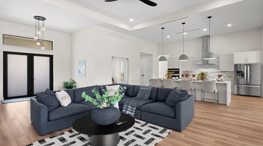 Open Concept Living Area With Tray Ceiling.