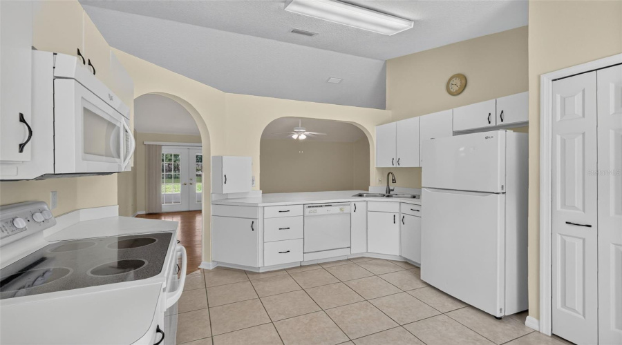 Kitchen With Closet Pantry And Breakfast Bar.