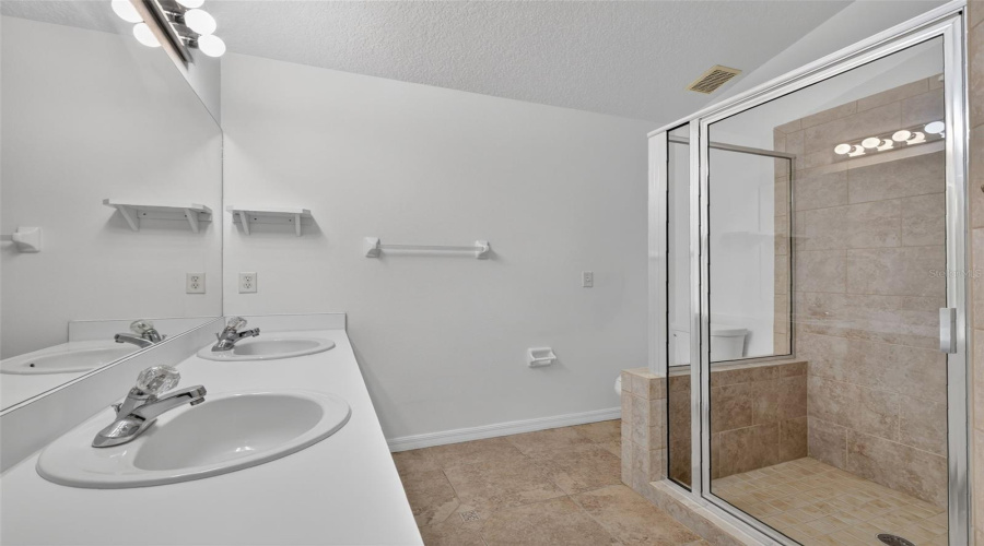 Primary Suite Bathroom With Dual Sinks.
