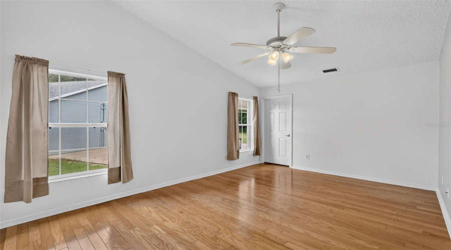 Primary Suite 2 With Walk In Closet And Wood Floors.