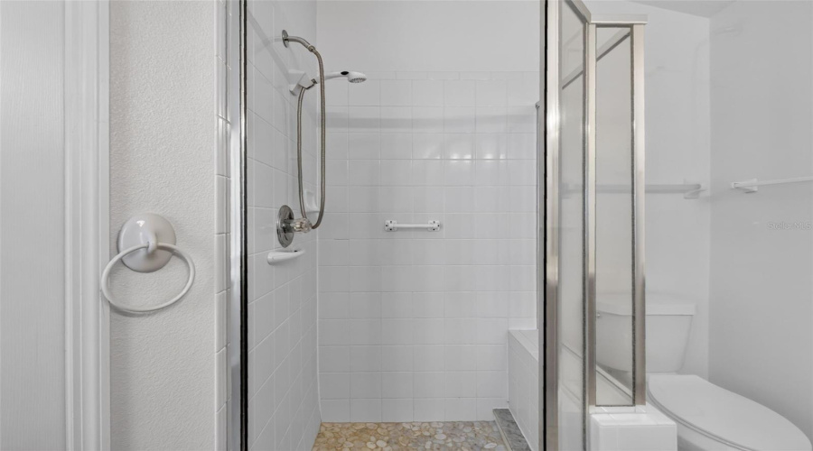 Primary Suite 2 Bathroom With Tiled Shower.