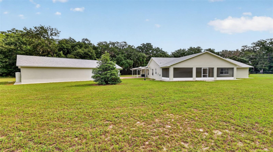 Rear Exterior With Garage View.