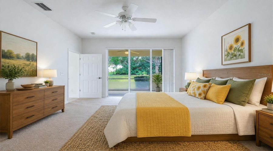 Virtually Staged-Bright Primary Bedroom Opens To Lanai