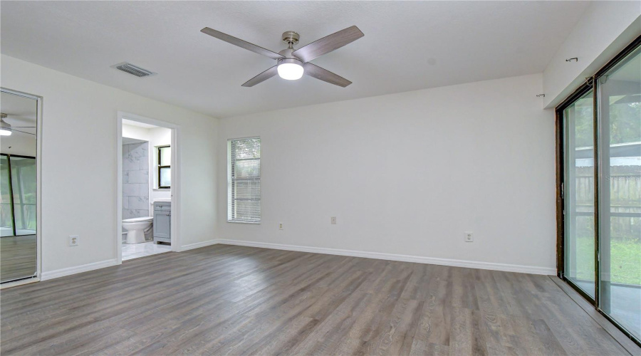 Primary Bedroom With En-Suite Bathroom And Large Walk-In Closet.