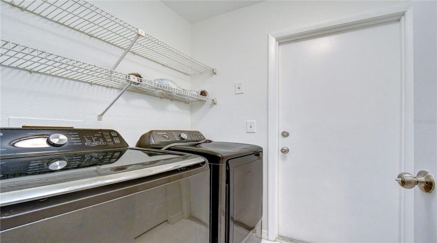 Laundry Room Off Entry Hallway With Access To Garage