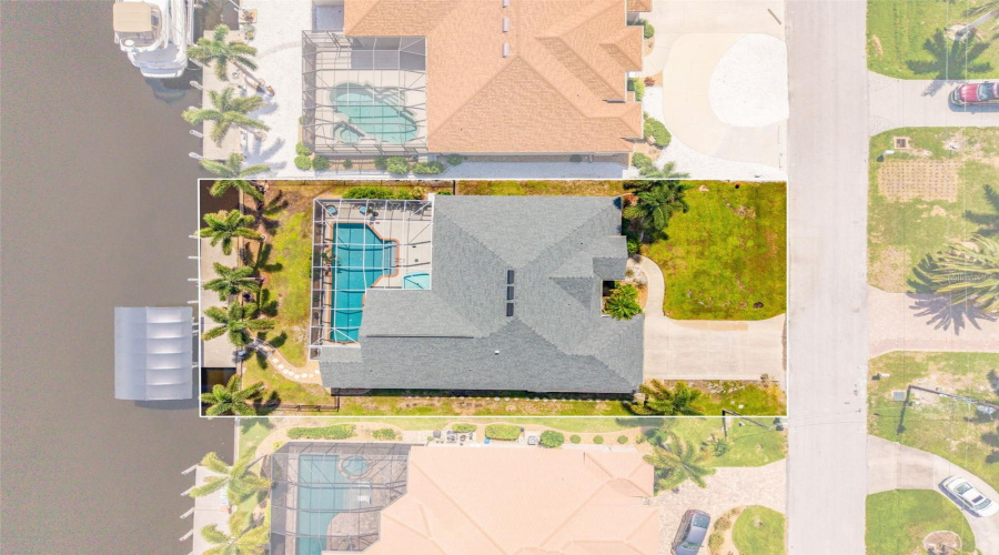 Overhead View Of Home, Pool &Amp; Sailboat Canal