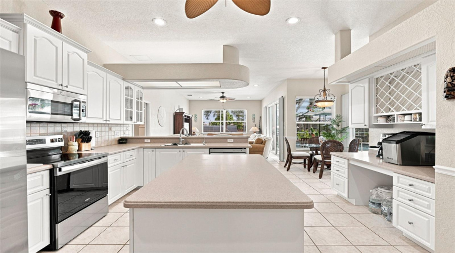 Rich Corian Countertops And Island Prep Area