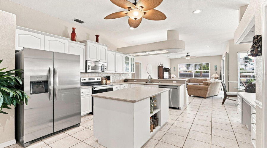 Open Kitchen With Center Island &Amp; Stainless Steel Appliances