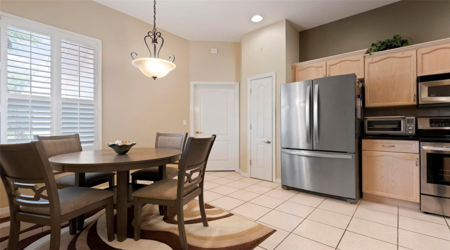 Kitchen Eat-In Area And Pantry Door And Utility Room Door