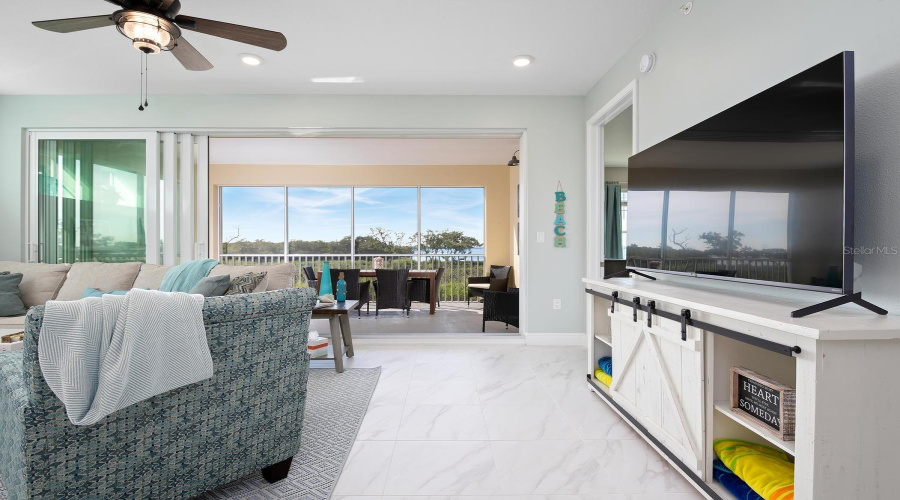 Open Floor Plan, With Wall To Wall Slider To Screened In Lanai And Waterfront Bay And Sunset Views