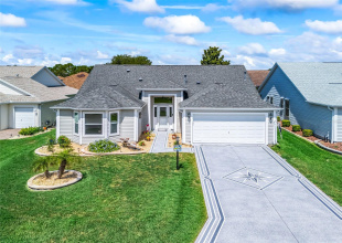 Well-maintained home with attractive curb appeal, mature landscaping, a welcoming covered entry, and an attached two-car garage.
