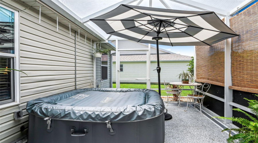 Screen-Enclosed Patio Creates A Private Setting For The Hot Tub, With Room For Additional Seating And Easy Access From The Adjoining Lanai.