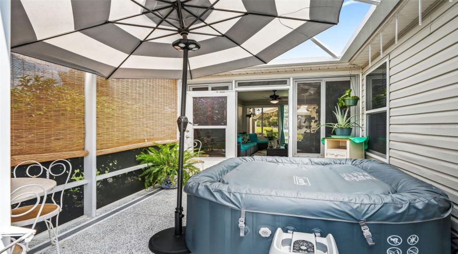A Freestanding Canopy And Screened Enclosure Provide Shade And Privacy, Creating A Relaxing Outdoor Space To Enjoy The Spa Throughout The Year.