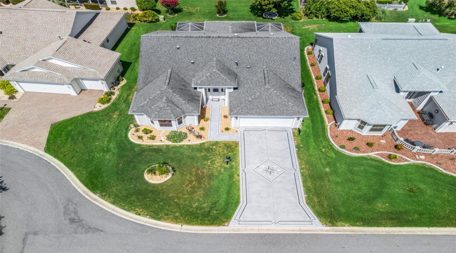 Elevated Perspective Highlights The Home’s Attractive Curb Appeal, Spacious Driveway, Landscaped Lot, And Quiet Residential Setting.